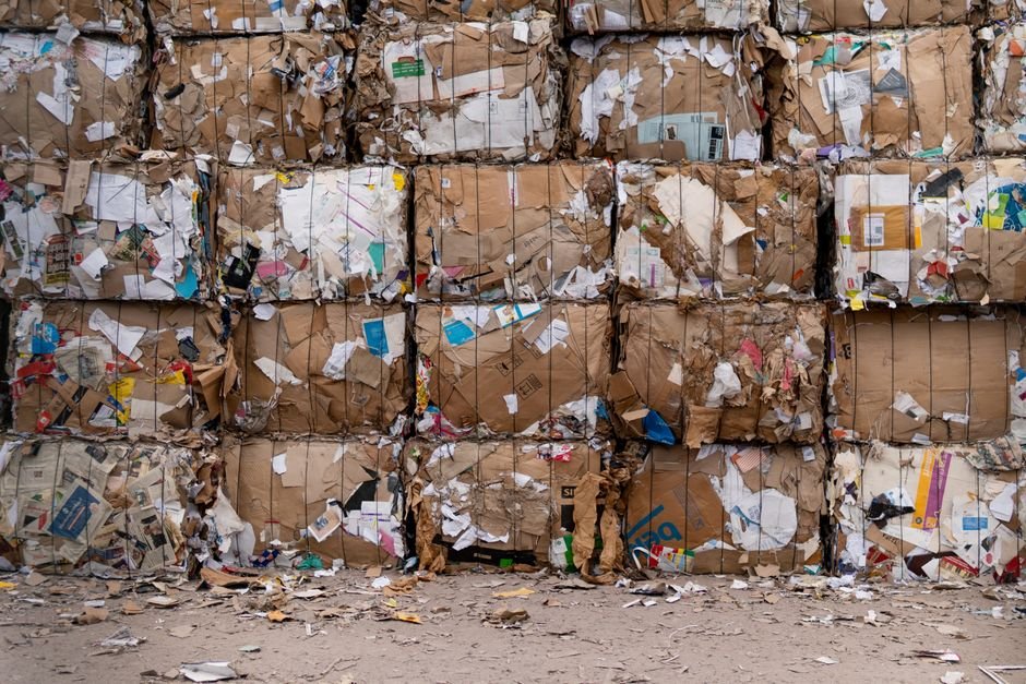 Baled cardboard and paper stacked for recycling