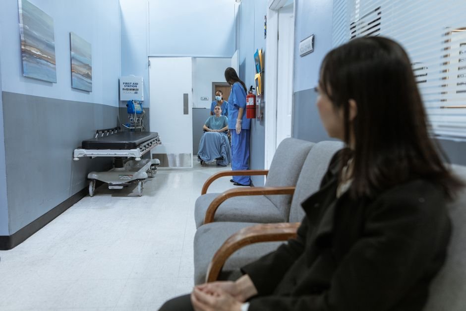 Clinic waiting room hallway with seating for patients