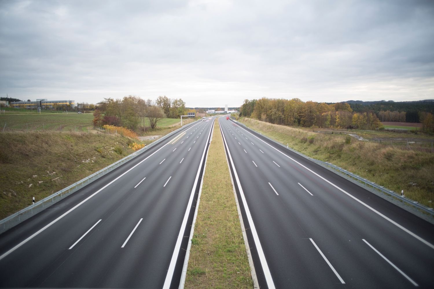 Empty highway stretching through open countryside