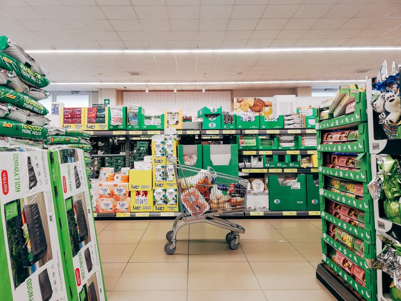 Shopping cart in a supermarket aisle