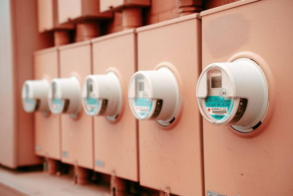 Row of residential utility meters tracking electric and water use