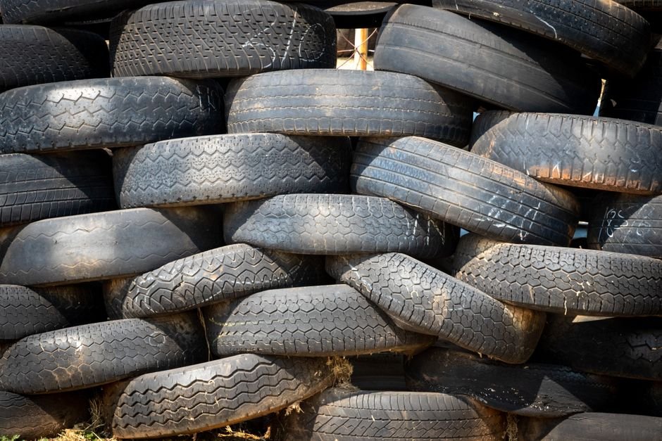 Stack of worn tires ready for drop off at a disposal facility