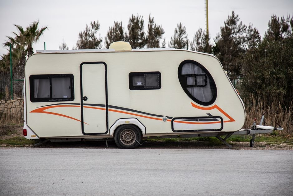Travel trailer camper parked outdoors, ready for a road trip