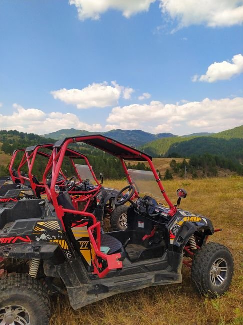 Side by side UTVs parked outdoors, the kind of off road vehicle sold at Sportsmans Corner in Algona Iowa